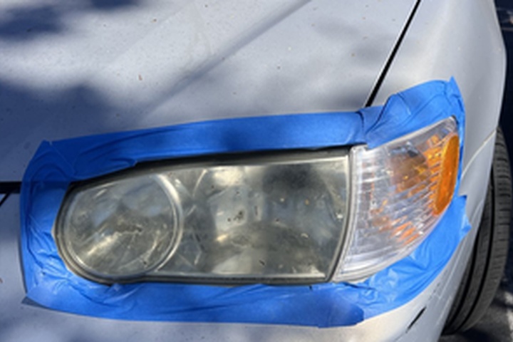 Silver Toyota sedan headlight before ANHEM restoration