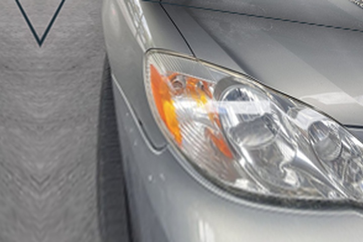 Gold Toyota Corolla headlight after ANHEM restoration