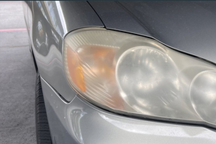 Gold Toyota Corolla headlight before ANHEM restoration