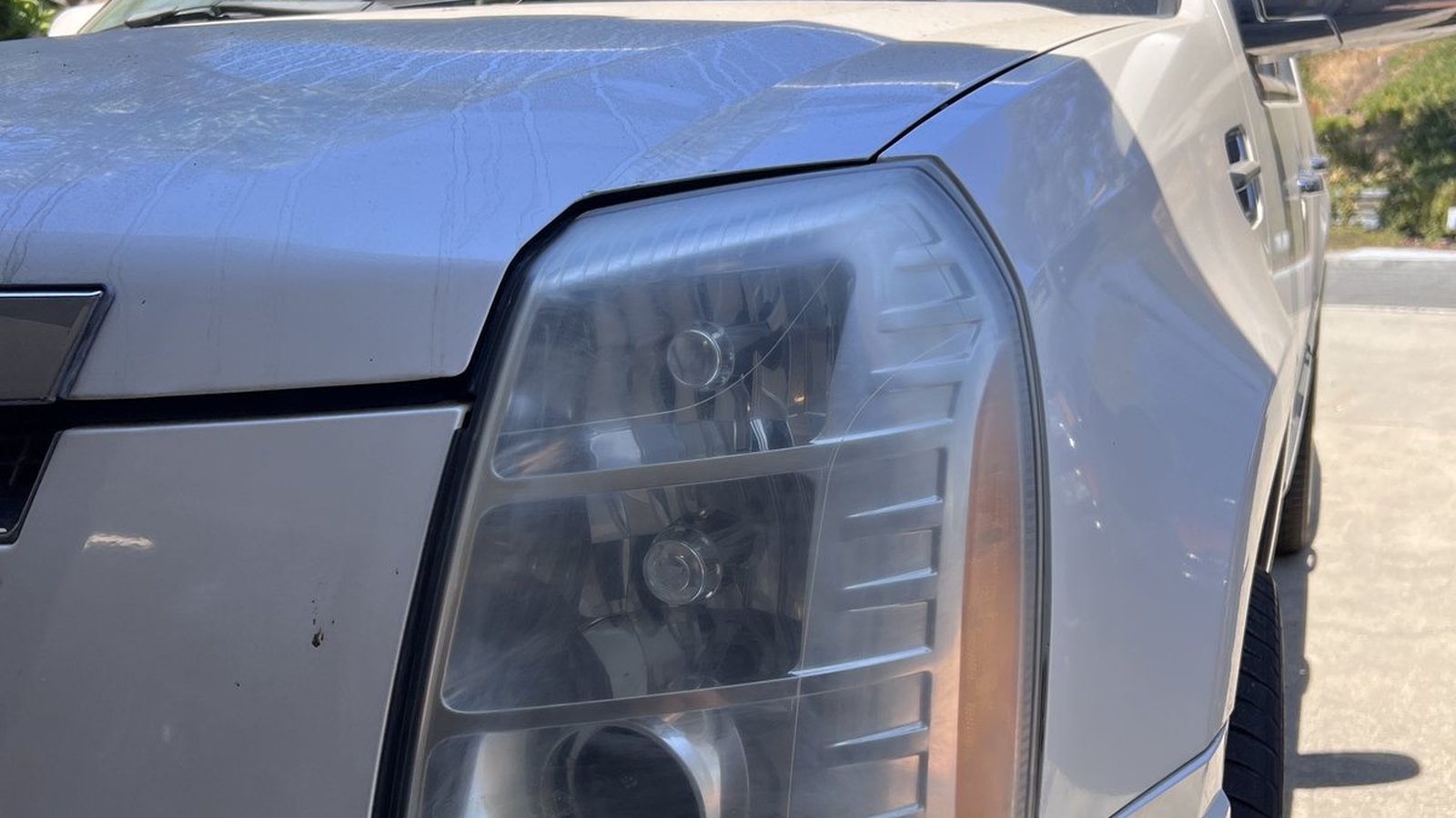 Cadillac Escalade headlight before ANHEM restoration
