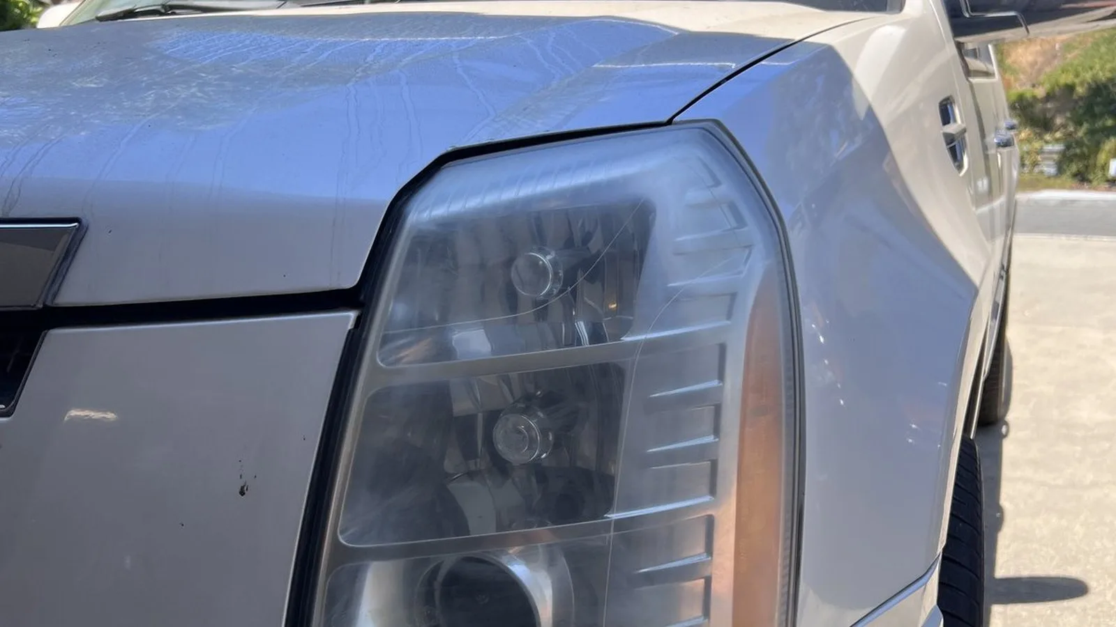 Cadillac Escalade headlight before ANHEM restoration