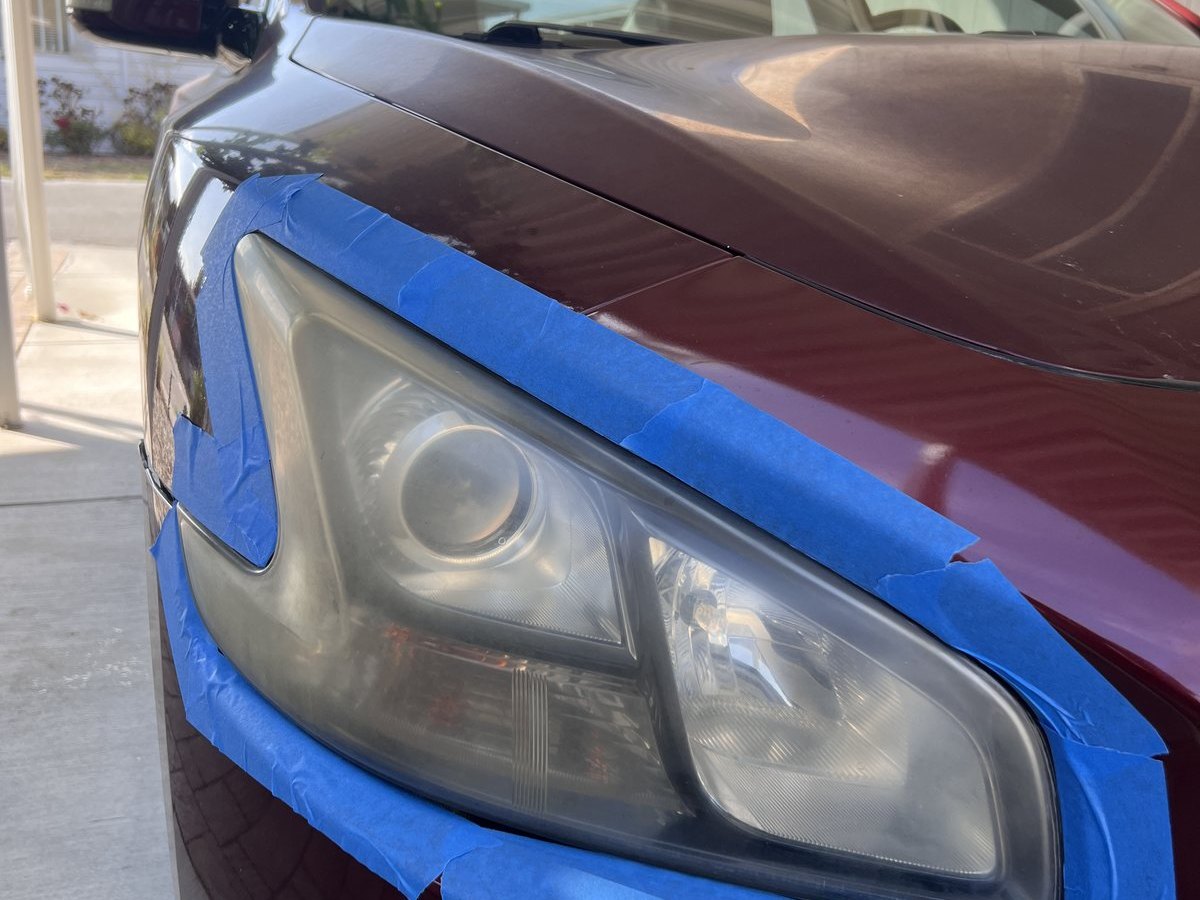 ANHEM headlight restoration prep stage with masking