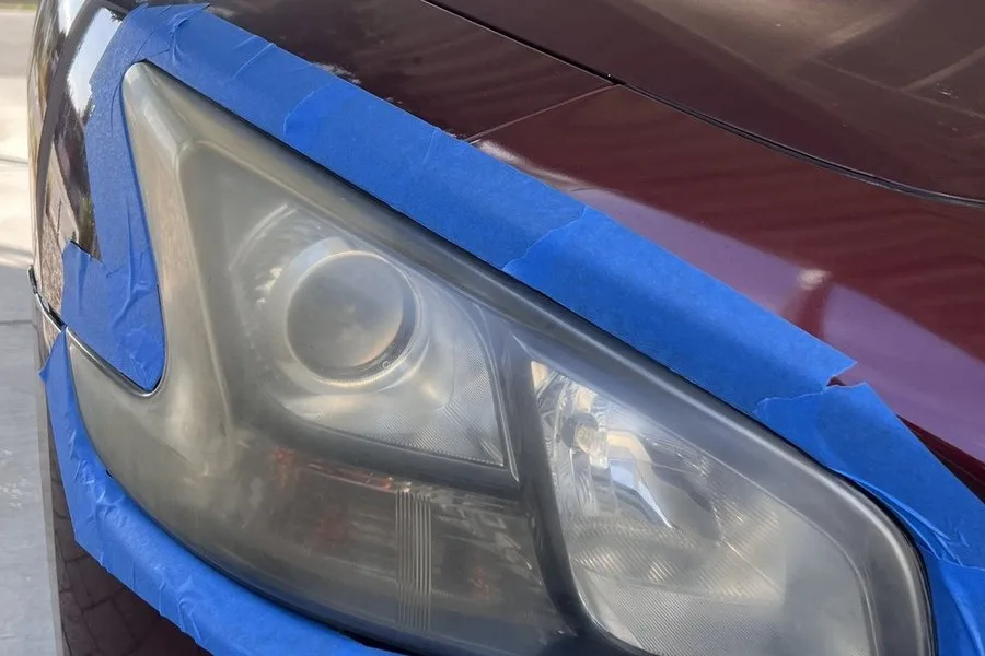 ANHEM headlight restoration prep stage with masking